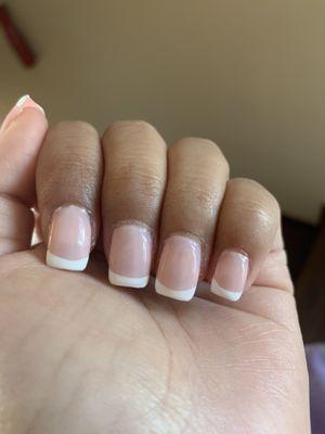 Cuticles uncut. French tip line work uneven and pinky nail completely different from the rest! Sloppy work.