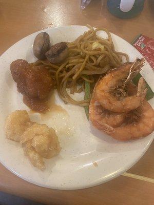 Chowmein, mushrooms, orange chicken, deep fried shrimps; and coconut shrimps