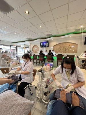 (Background) The acrylic nail bar, (foreground) my toes getting some TLC