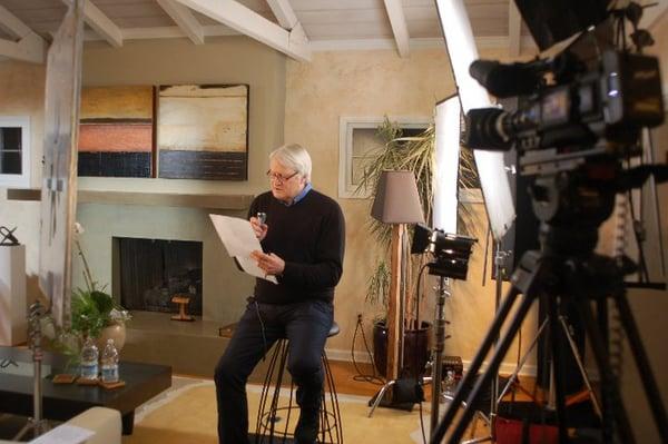 Charles Martinet, voice of Mario, studies his lines before his on-camera narration.