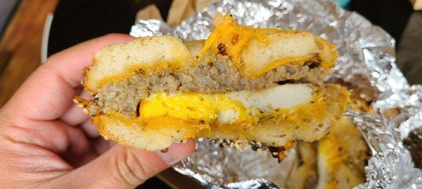 Breakfast bagel with goetta egg and cheddar cheese