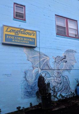 The east side of the building still has a sign from Longfellow's, the former occupant.