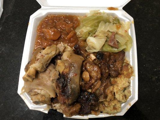 Pig feet, oxtail, steamed rice, dressing, cabbage and candy yams.