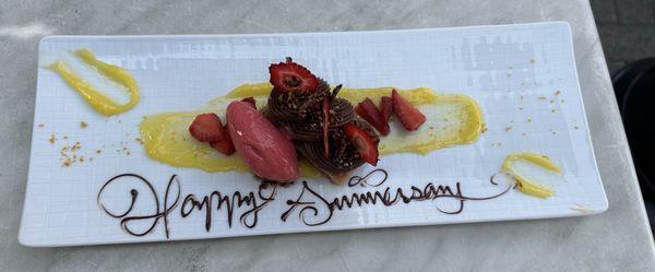 Chocolate ganache and mousse with mango coulis and fresh fruit