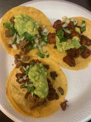 Street tacos with guacamole on top