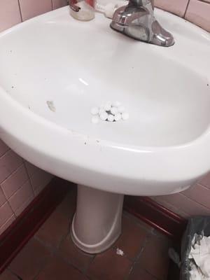 Moth balls in the sink, filth everywhere. Food can't be kept to a high standard of cleanliness w the bathroom this bad can it?