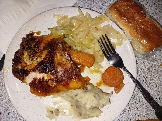 Roasted chicken, yams, cabbage and mashed potatoes.