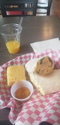 Breakfast Burrito served with cornbread and honey. With a Screwdriver drink.