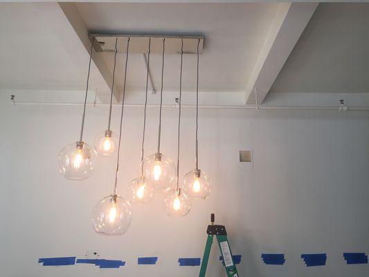 This is the installation of new light fixture on a concrete ceiling for a residential client