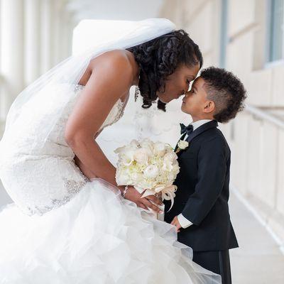 Bride sharing a moment with the best ring bearer in the world!