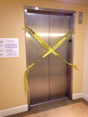 Elevator malfunction reported 12/1 and allowed to function for another week until someone got stuck in it.