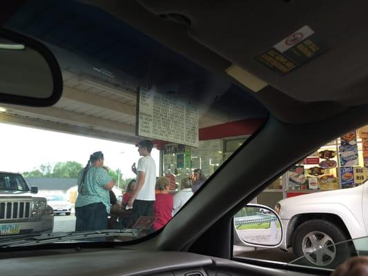 Sitting in the car enjoying the food and music.