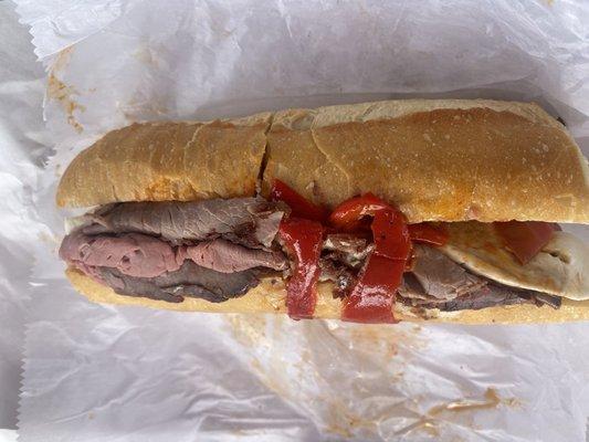 Roast beef, fresh mozzarella, roasted and hot peppers sandwich