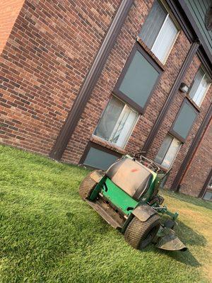 Unattended lawnmower left on & running outside my window at 7:50 AM.