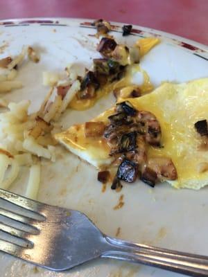 Burnt ingredients in my omelet at Huddle House in Philadelphia, MS.