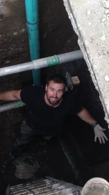 Owner Zach in a trench doing a sewer repair!