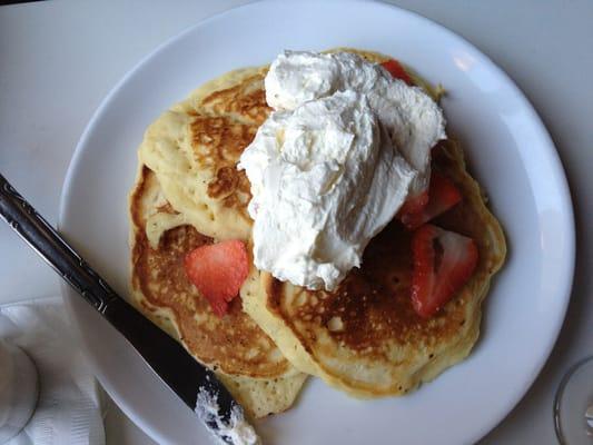 Pancakes with strawberries and fresh cream