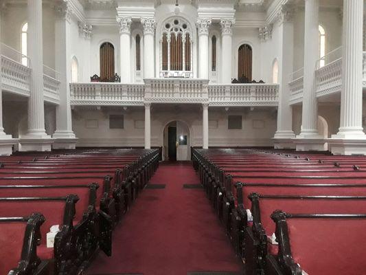 Sanctuary rear with view of the organ & organ pipes.