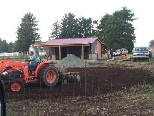 The Farm Stand Site, prepping the parking lot and finishing the wood siding