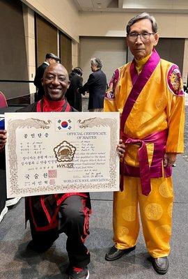 JIKJN Tim promoting to the rank of 6th Degree Master with Kuk Sa Nim, Grandmaster, In Hyuk Suh