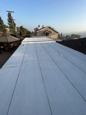 Owens Corning 50 year Forest Brown shingles with Polyfresco torch down for the flat roof.