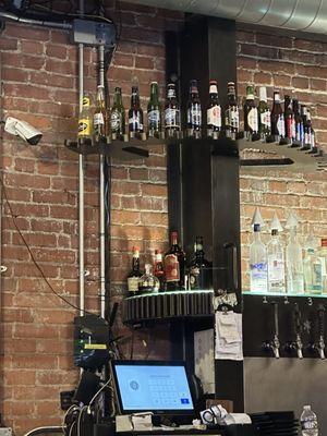 Gears built into the bar shelving.