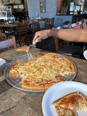 Cheese pull on one of the smallest pieces! It was great pizza!