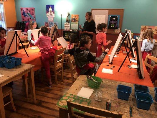 A kid painting birthday party at our Carmel Myart Studio!