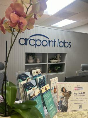 ARCpoint labs reception with flyers