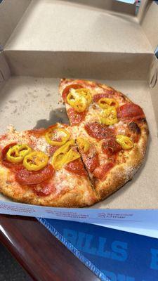 Personal pizza  with pepperoni and banana peppers