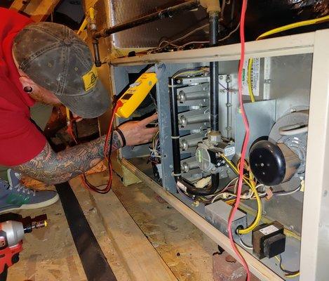 Our technician busy at work, fixing a gas furnace for a local Houston customer!