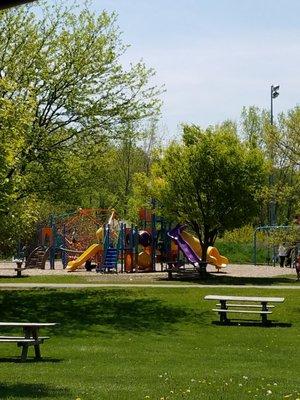 Playscape for kids looks real safe along with Picnic tables to have lunch or take a break