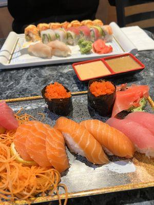 Salmon Sashimi. Tuna, Salmon Nigiri. Masago Maki. Rainbow Roll, Alaskan Roll.