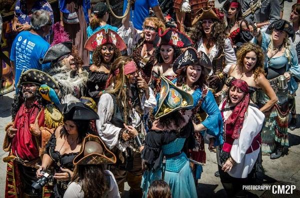 The Outlaw Pirates plus a few other mateys, singing sea shanties, At Belmont Shore Pirate Invasion 2014, June 2014. Long Beach