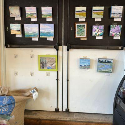 Small paintings near the register