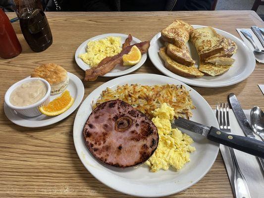 Ham and egg special with biscuit and gravy. French toast with eggs and bacon.