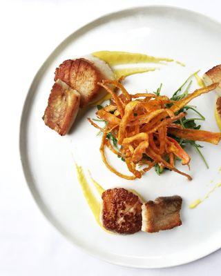 Scallops, pork belly, and crispy carrot ribbons.