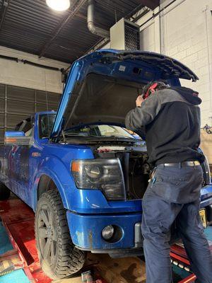 Jake working on a pickup on our Hunter Alignment rack.