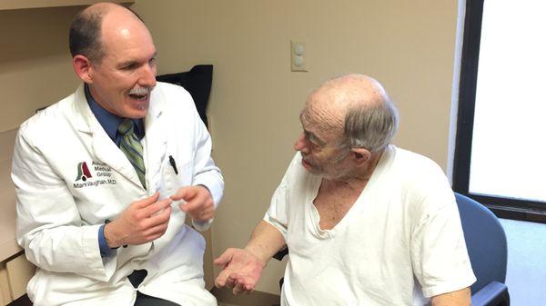 Dr. Mark Vaughan giving an explanation to a patient