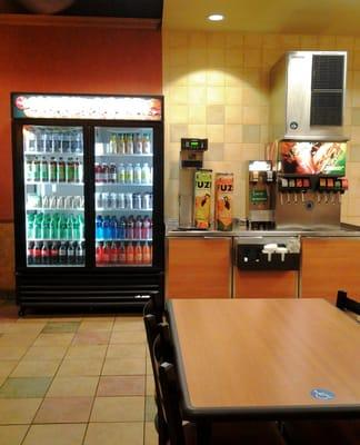 Well stocked refrigerated case and neat and clean fountain area