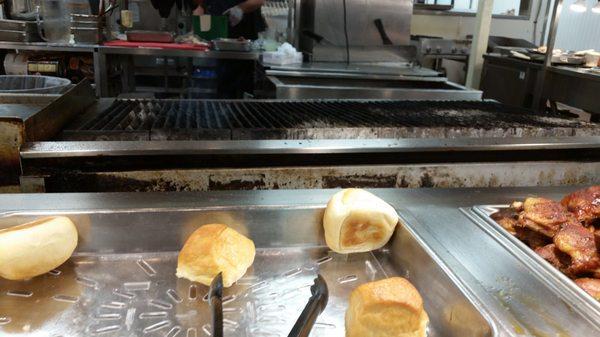 Just too many rolls to choose from. And look at all those steaks fired up on that grill behind them (NOT!)