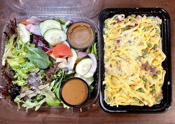 Mixed greens salad on left and pasta alla carbonara on right