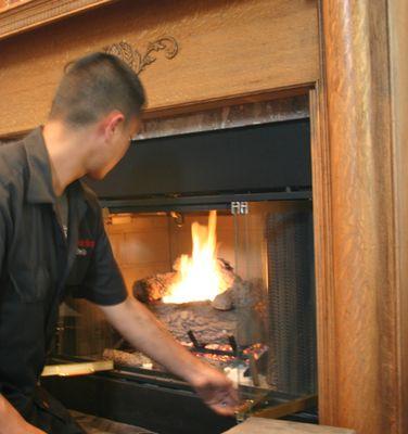 Adjusting the flame on a gas fireplace