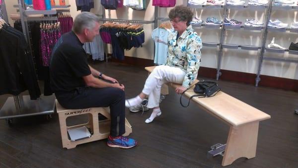 Owner Paul Morrison performs a shoe fitting