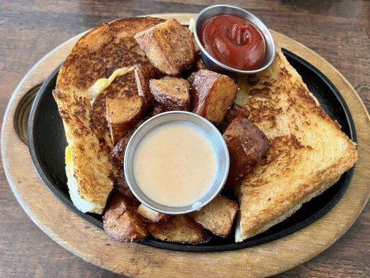 Grown Man Grilled Cheese (artisan bread with smoked Gouda and jack cheeses, tomato dipping sauce) and Potato Wedges