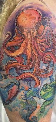 A water color tattoo half sleeve of some of my favorite sea life.