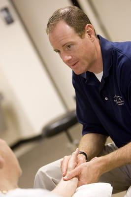 Andy Moriarty, clinic director and physical therapist, working with patients