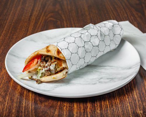 "Wrap up your cravings with our mouthwatering chicken/beef wrap - packed with flavor and ready to delight!"