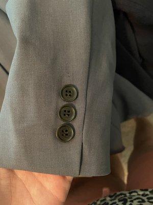 Buttons not sewn on correctly.