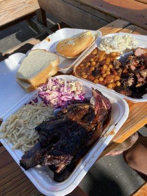 Mac & cheese, cole slaw, beans, potato salad, pulled pork and ribs